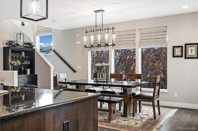 1882 W 67th Ave, Denver, CO 80221 - dining area featuring dark wood finished floors, plenty of natural light, a chandelier, stairs, and recessed lighting