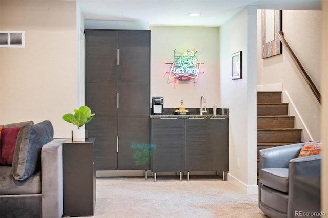 1882 W 67th Ave, Denver, CO 80221 - living room with wet bar, stairway, light colored carpet, and recessed lighting