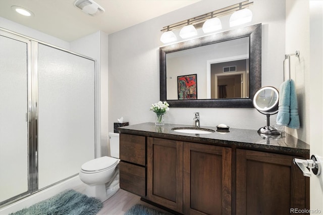 1882 W 67th Ave, Denver, CO 80221 - bathroom with vanity, a stall shower, and wood finished floors