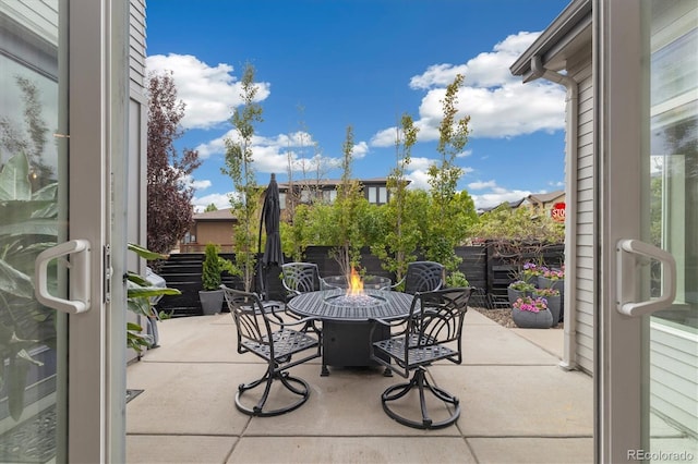 1882 W 67th Ave, Denver, CO 80221 - view of patio / terrace featuring an outdoor fire pit