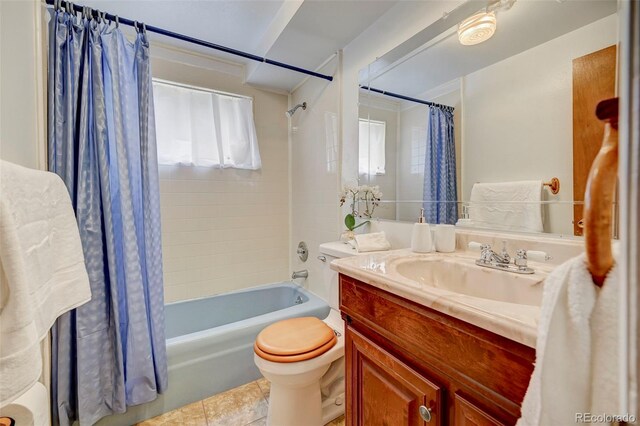 full bathroom featuring vanity, toilet, shower / bath combination with curtain, and tile patterned flooring