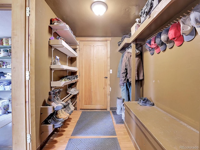 mudroom with light wood-style flooring