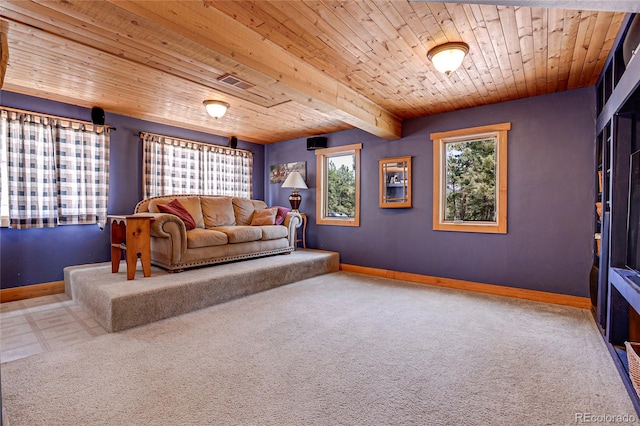 interior space featuring carpet floors, wooden ceiling, and baseboards