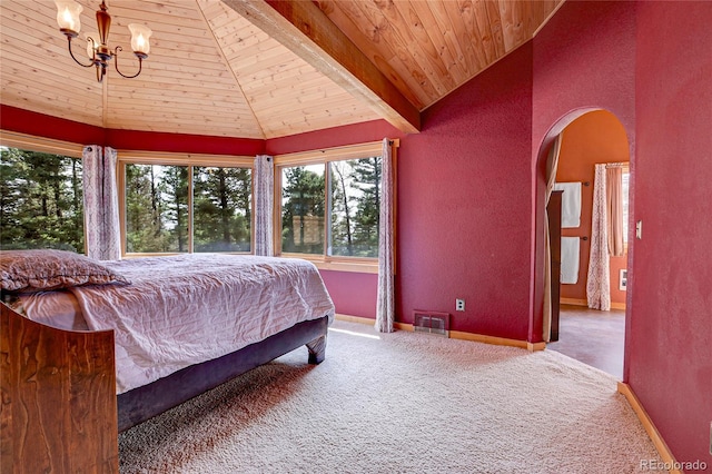 bedroom featuring carpet floors, wood ceiling, arched walkways, and baseboards