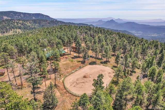 bird's eye view featuring a mountain view and a wooded view