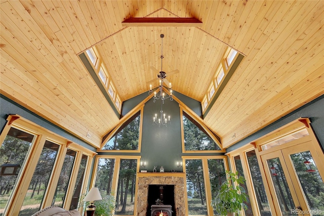 26526 Gray Buck Trl, Conifer, CO 80433 - detailed view of a chandelier, wood ceiling, and a wood stove