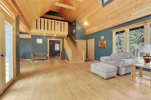 26526 Gray Buck Trl, Conifer, CO 80433 - living room with high vaulted ceiling, wooden ceiling, stairs, hardwood / wood-style floors, and healthy amount of natural light