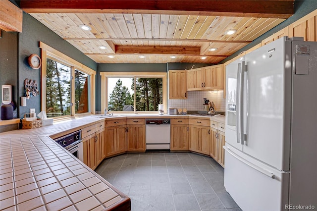 26526 Gray Buck Trl, Conifer, CO 80433 - kitchen featuring white appliances, tile countertops, wood ceiling with exposed beams, backsplash, and light brown cabinets