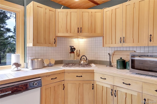 26526 Gray Buck Trl, Conifer, CO 80433 - kitchen featuring light brown cabinetry, dishwashing machine, tile countertops, lofted ceiling, and wooden ceiling