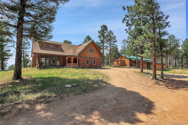 26526 Gray Buck Trl, Conifer, CO 80433 - view of front of home featuring dirt driveway and roof with shingles