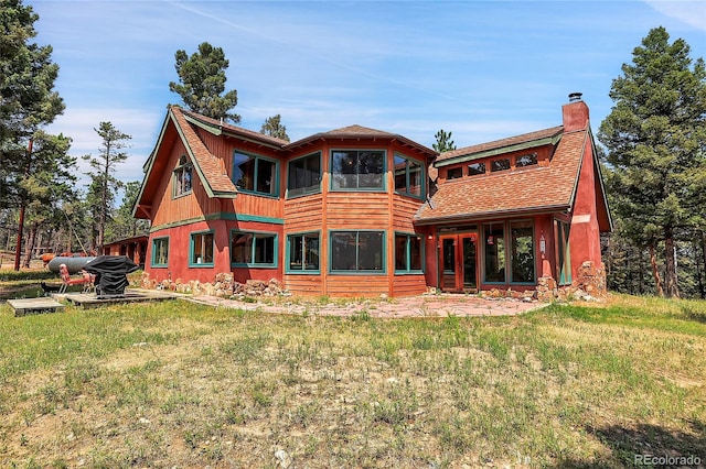 26526 Gray Buck Trl, Conifer, CO 80433 - rear view of property featuring a chimney and a yard