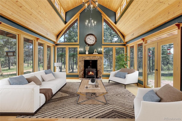 26526 Gray Buck Trl, Conifer, CO 80433 - sunroom / solarium with wooden ceiling, a chandelier, french doors, and high vaulted ceiling