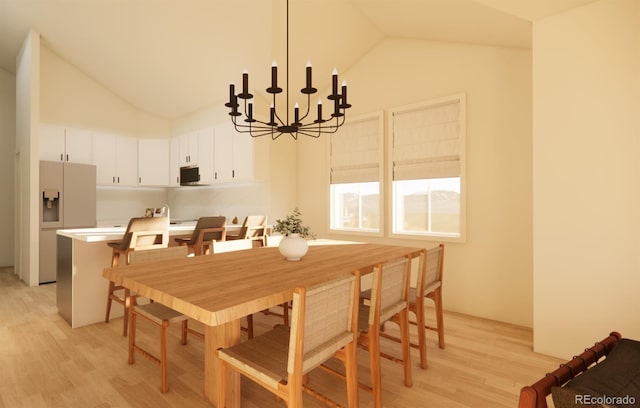 dining space with light wood-type flooring and vaulted ceiling