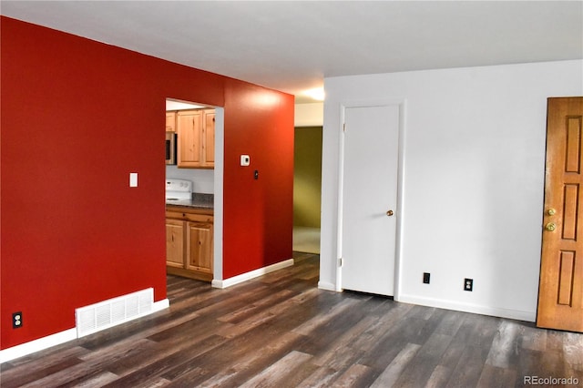 1029 W 102nd Pl, Northglenn, CO 80260 - unfurnished room with dark wood-style floors and baseboards