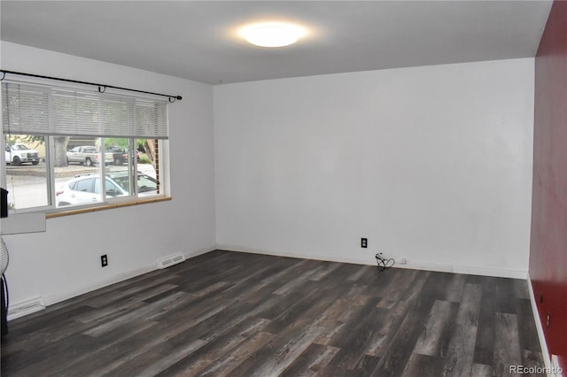1029 W 102nd Pl, Northglenn, CO 80260 - unfurnished room featuring dark wood-style floors and baseboards
