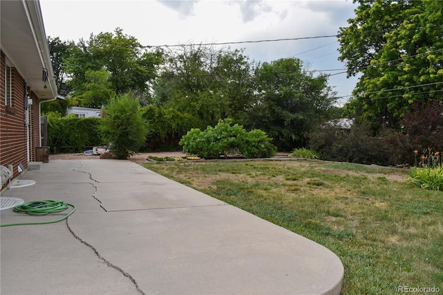 1029 W 102nd Pl, Northglenn, CO 80260 - view of grassy yard featuring a patio