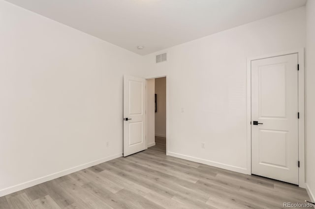 374 N Geneva St, Aurora, CO 80010 - unfurnished room with light wood-style flooring and baseboards
