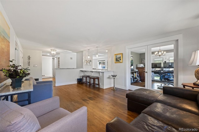 living room featuring baseboards and wood finished floors