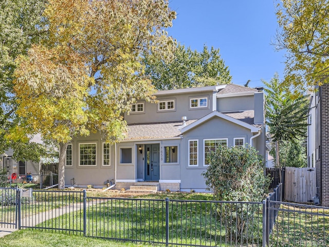 view of property featuring a front yard