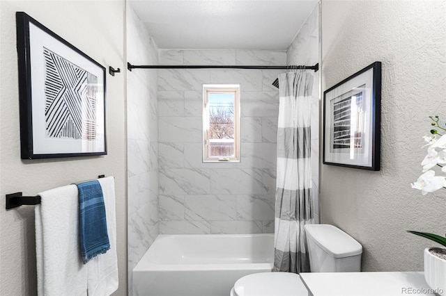 full bath featuring a textured wall, shower / bath combo, and toilet