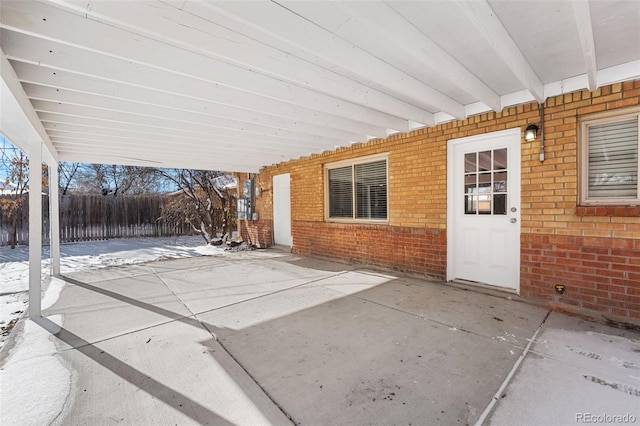 view of patio / terrace featuring fence