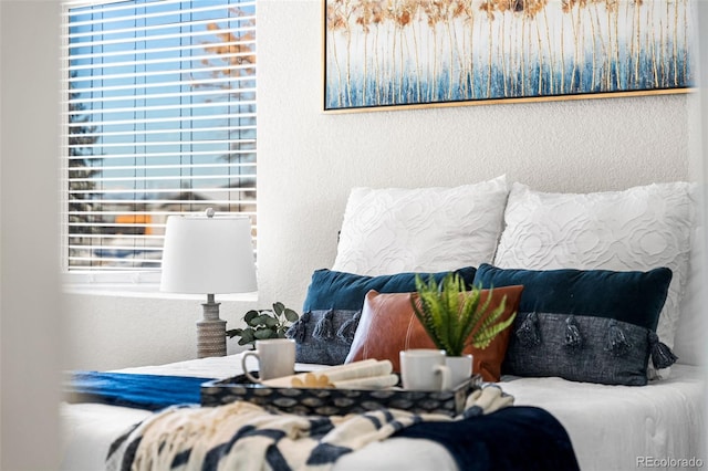 bedroom featuring a textured wall