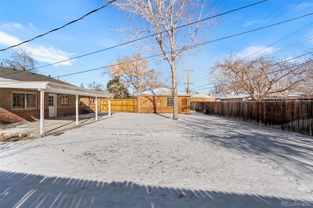 view of yard featuring an outbuilding, a patio area, and a fenced backyard