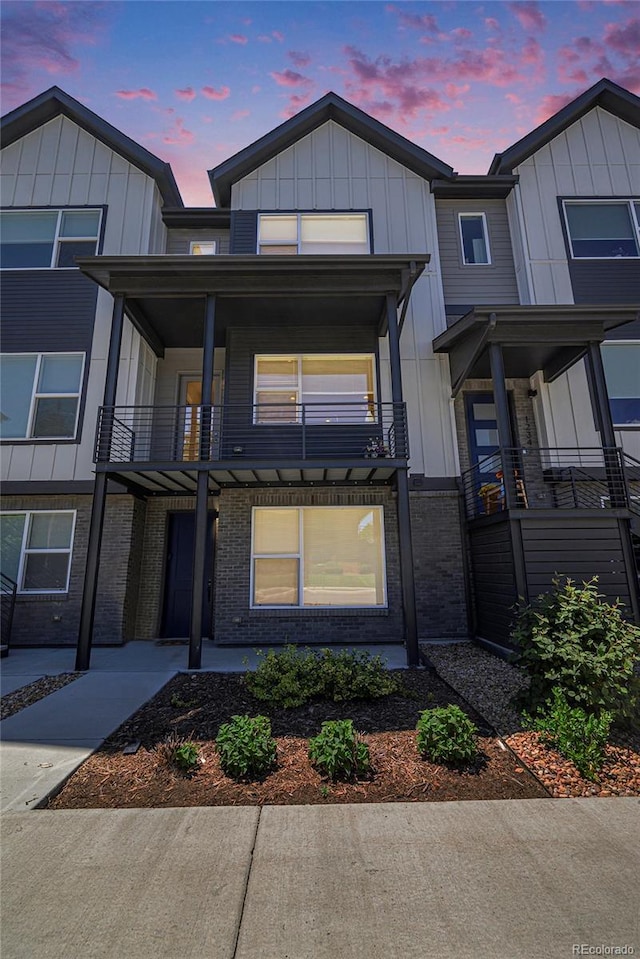 12336 W 52nd Ave, Wheat Ridge, CO 80033 - multi unit property with a balcony, board and batten siding, and brick siding