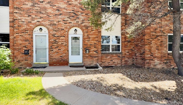 3616 W Radcliff Ave, Denver, CO 80236 - doorway to property featuring brick siding