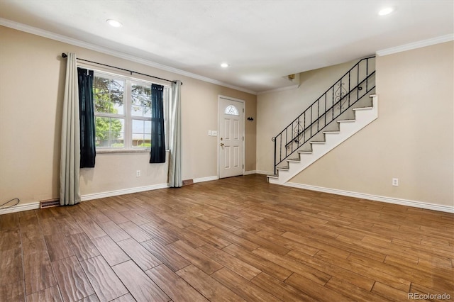 3616 W Radcliff Ave, Denver, CO 80236 - entrance foyer featuring wood finished floors, stairway, baseboards, crown molding, and recessed lighting