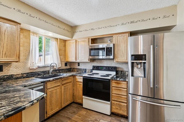 3616 W Radcliff Ave, Denver, CO 80236 - kitchen featuring stainless steel appliances, a sink, a textured ceiling, backsplash, and open shelves