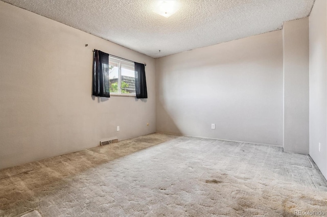 3616 W Radcliff Ave, Denver, CO 80236 - carpeted empty room with a textured ceiling