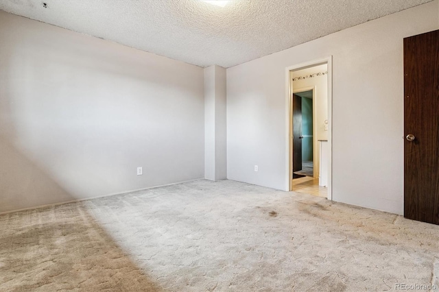 3616 W Radcliff Ave, Denver, CO 80236 - carpeted empty room with a textured ceiling