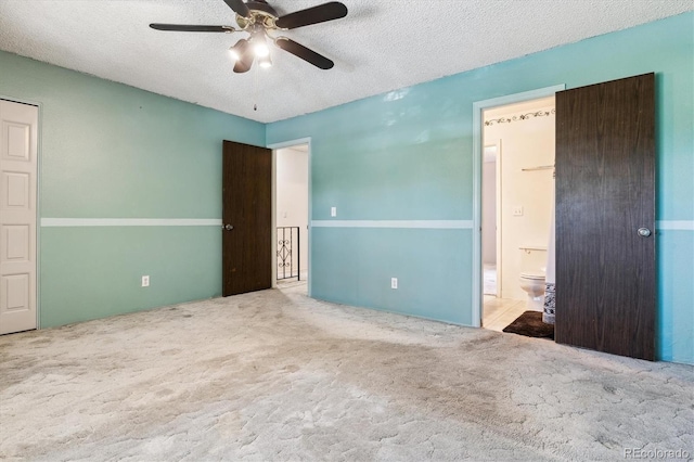 3616 W Radcliff Ave, Denver, CO 80236 - unfurnished bedroom featuring carpet flooring, a textured ceiling, ensuite bathroom, and ceiling fan