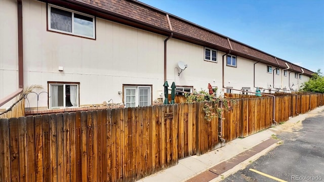 3616 W Radcliff Ave, Denver, CO 80236 - view of side of property featuring mansard roof and a shingled roof