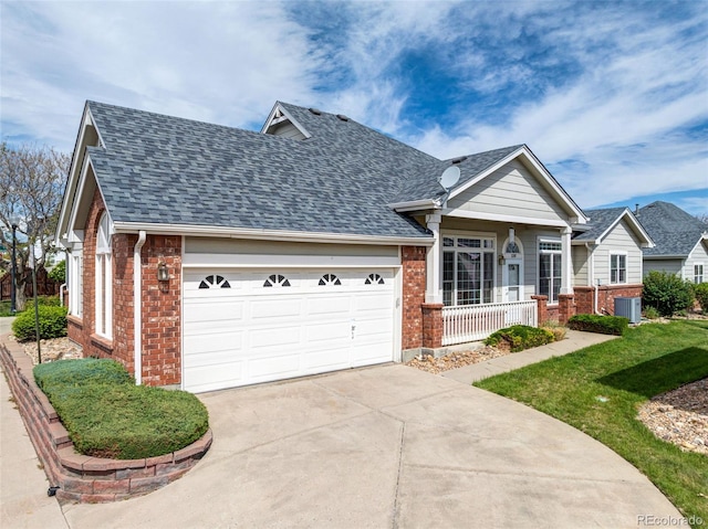 view of front of home featuring brick siding, an attached garage, and roof with shingles