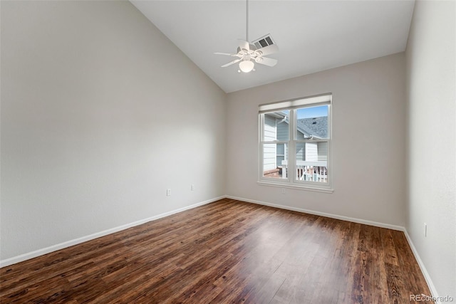 unfurnished room featuring vaulted ceiling, dark wood-type flooring, baseboards, and a ceiling fan