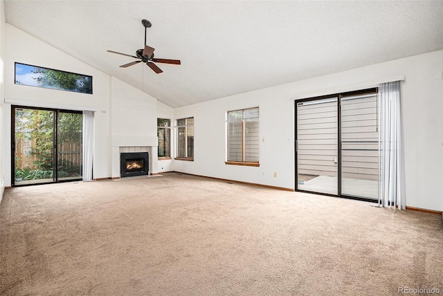 11196 E Baltic Dr, Aurora, CO 80014 - unfurnished living room featuring high vaulted ceiling, carpet flooring, ceiling fan, and a fireplace