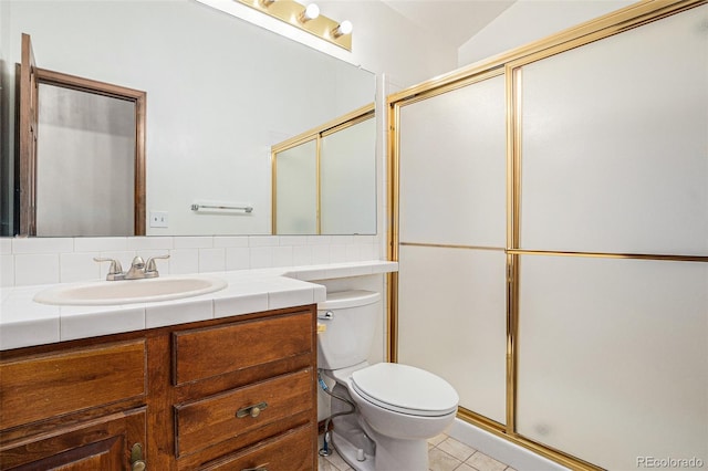 11196 E Baltic Dr, Aurora, CO 80014 - full bathroom featuring vanity, a shower with door, and tile patterned flooring