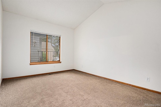11196 E Baltic Dr, Aurora, CO 80014 - carpeted spare room featuring lofted ceiling and baseboards