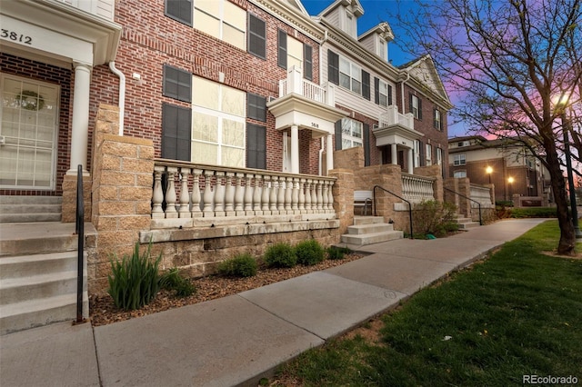 3818 S Dallas St, Aurora, CO 80014 - view of front facade featuring brick siding