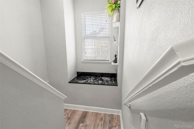 3818 S Dallas St, Aurora, CO 80014 - staircase featuring wood finished floors and baseboards