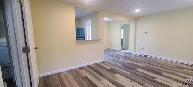 spare room featuring hardwood / wood-style flooring