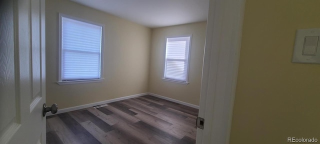 spare room featuring hardwood / wood-style floors