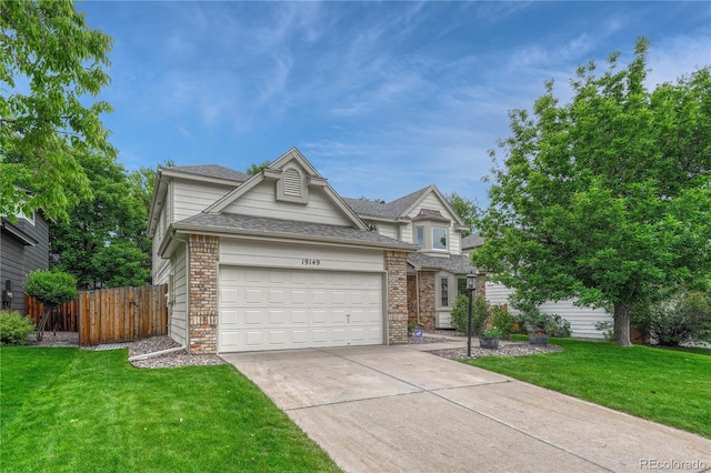 19149 E Ida Dr, Aurora, CO 80015 - traditional home with concrete driveway, an attached garage, roof with shingles, and brick siding