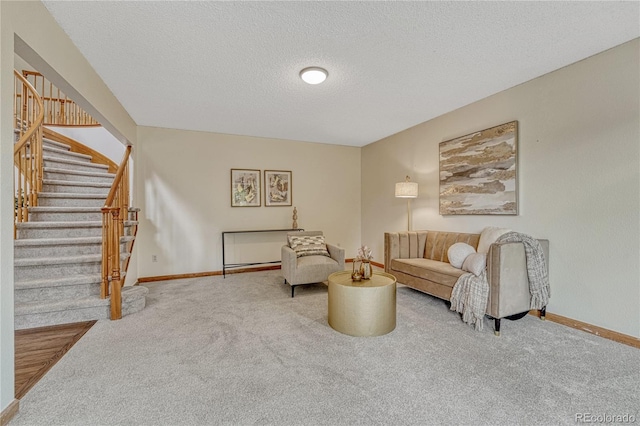 19149 E Ida Dr, Aurora, CO 80015 - carpeted living room featuring stairway, a textured ceiling, and baseboards