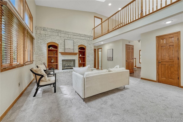 19149 E Ida Dr, Aurora, CO 80015 - carpeted living area featuring high vaulted ceiling, baseboards, a fireplace, built in features, and recessed lighting