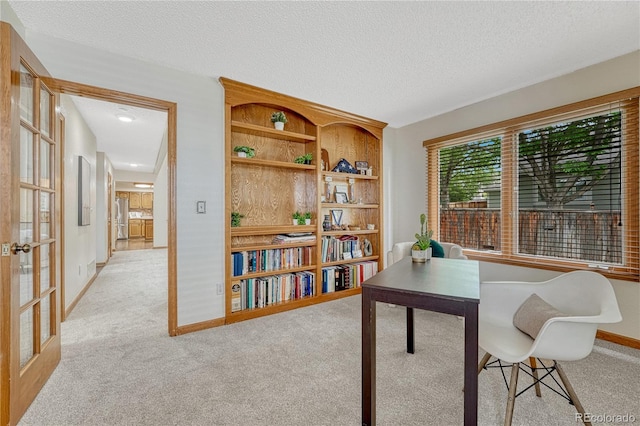 19149 E Ida Dr, Aurora, CO 80015 - carpeted home office featuring baseboards, french doors, and a textured ceiling