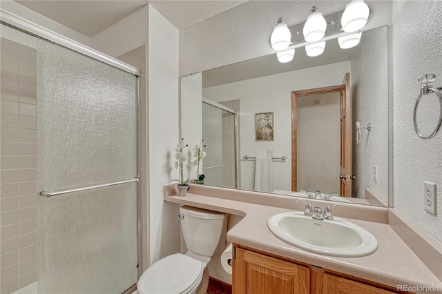 19149 E Ida Dr, Aurora, CO 80015 - full bath featuring a textured wall, toilet, a stall shower, and vanity
