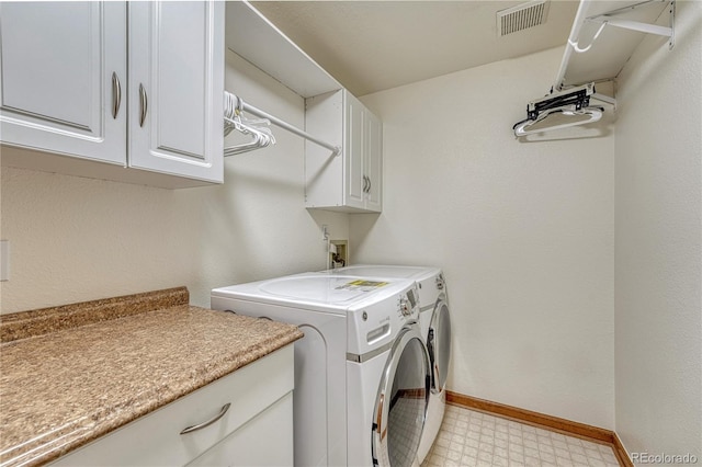 19149 E Ida Dr, Aurora, CO 80015 - washroom featuring cabinet space, washer and clothes dryer, light flooring, and baseboards